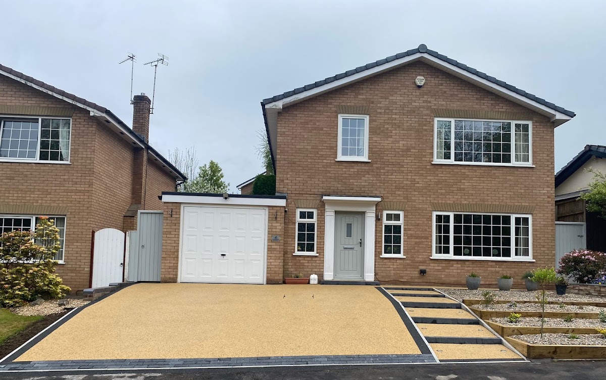 Golden resin bound driveway laid to a detached house in Greater Manchester